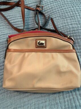 Dooney & Bourke Tan Crossbody with Brown Trim and Red Zip Accent